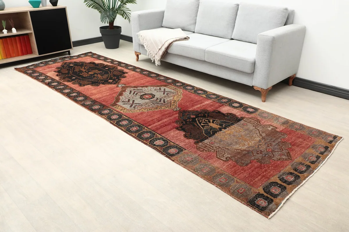 Angle view of the red and black geometric runner rug in a living space