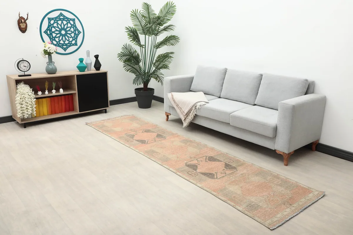 Wide shot of the runner rug in a room, showing its scale relative to furniture and decor elements.