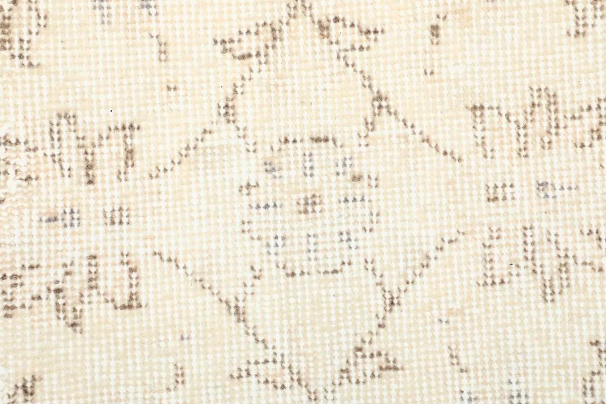 Close-up of the low wool pile and visible hand-knotted texture
