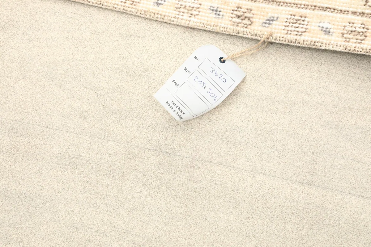 Product tag attached to the rug, indicating hand-made in Turkey