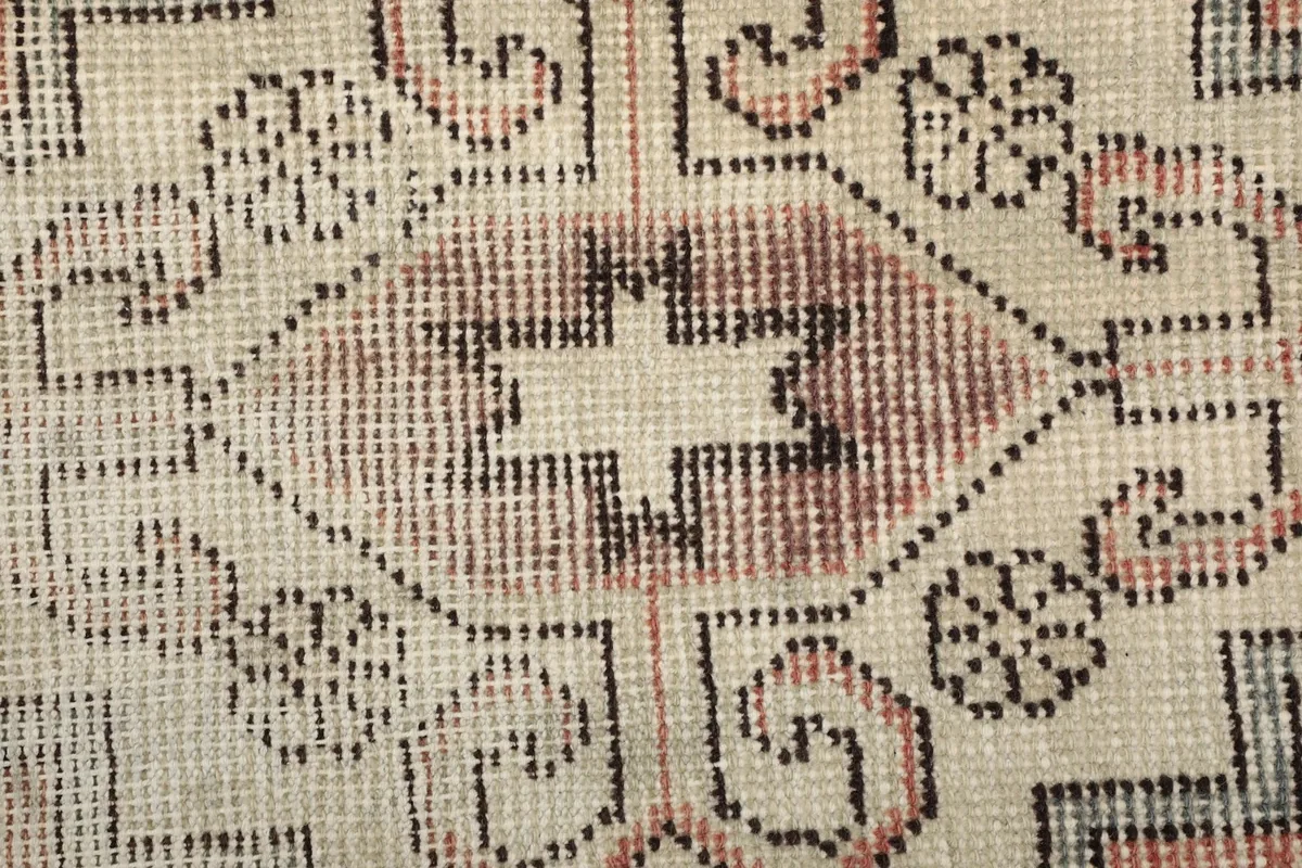 Close-up of the low wool pile and hand-knotted texture of the vintage runner.