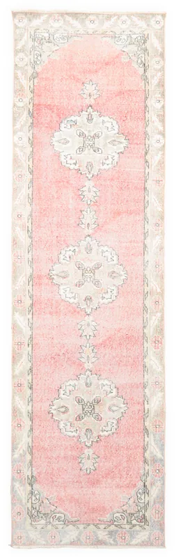 Full overhead view of the 3x11 vintage pink Anatolian runner rug with medallion motifs