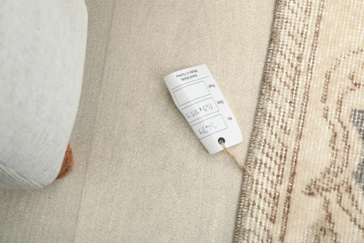 Rug label showing the dimensions 5'x8' and other product information next to the rug