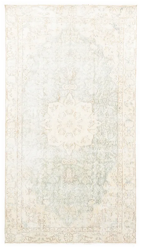 Full overhead view of the beige and brown vintage Anatolian runner rug on a white background.
