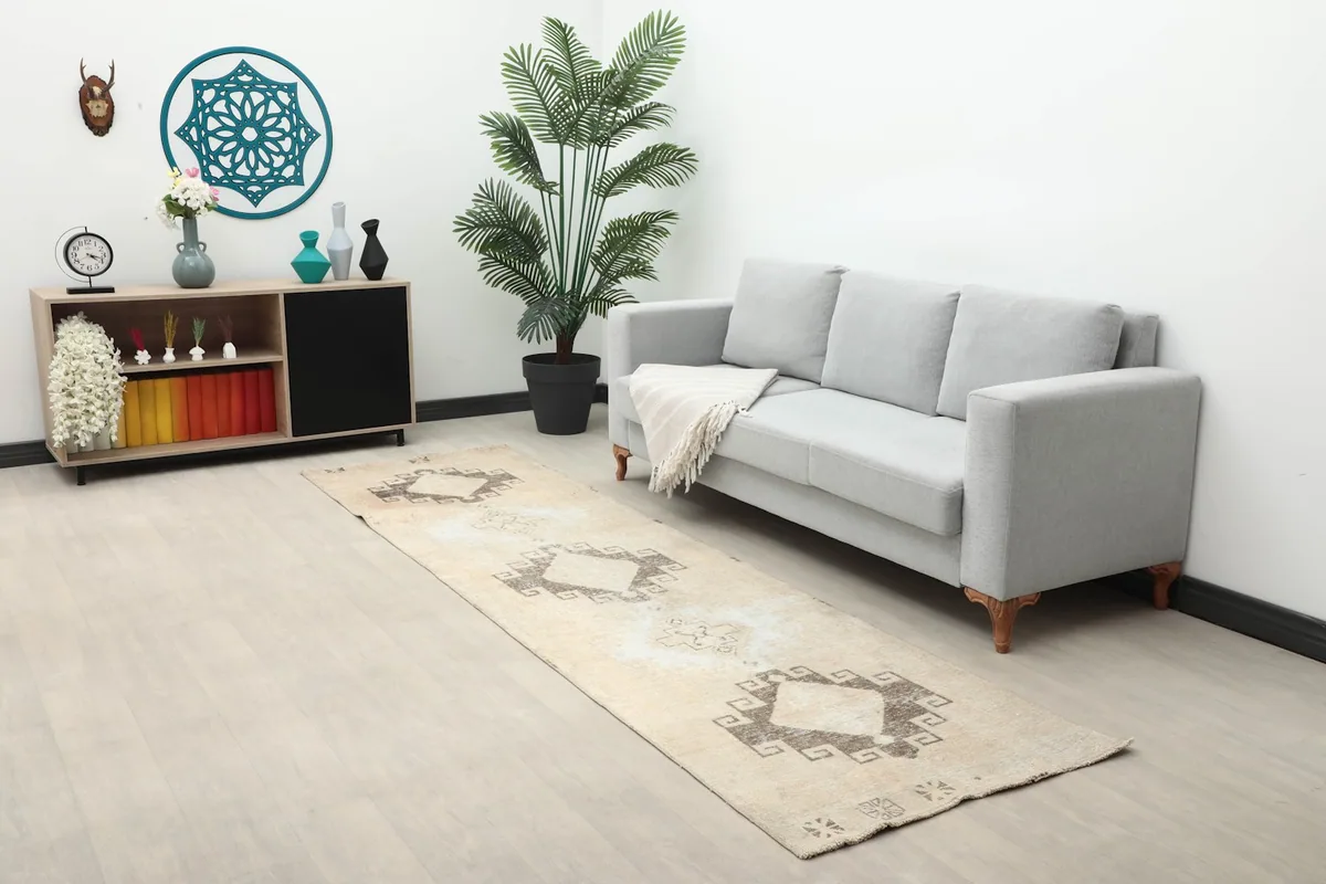 Long view of the runner rug in a living space with furniture, highlighting its placement.