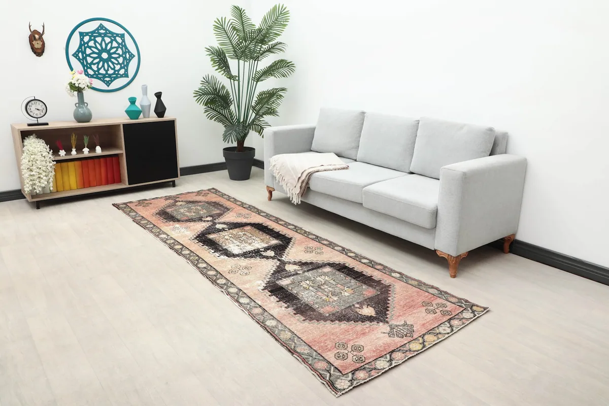 Full room view showing the vintage Anatolian runner rug in a living area with modern furniture