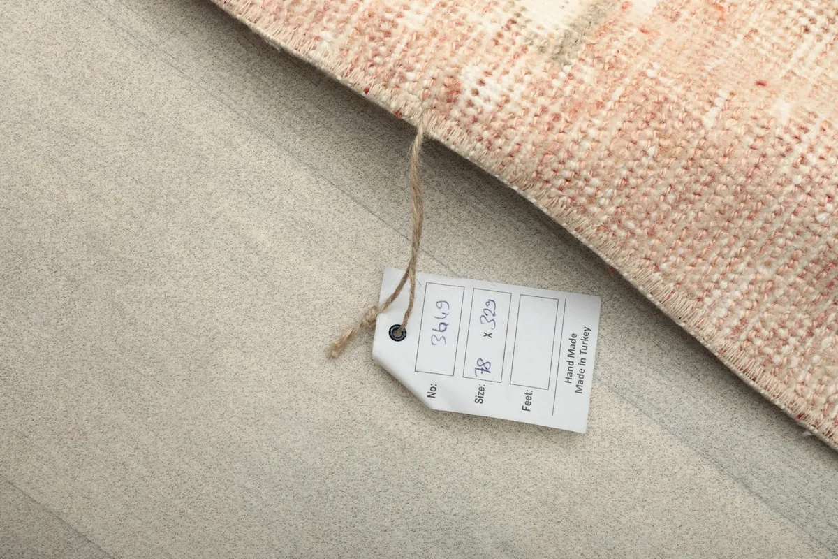 Product tag displaying the rug's size and 'Hand Made in Turkey' information