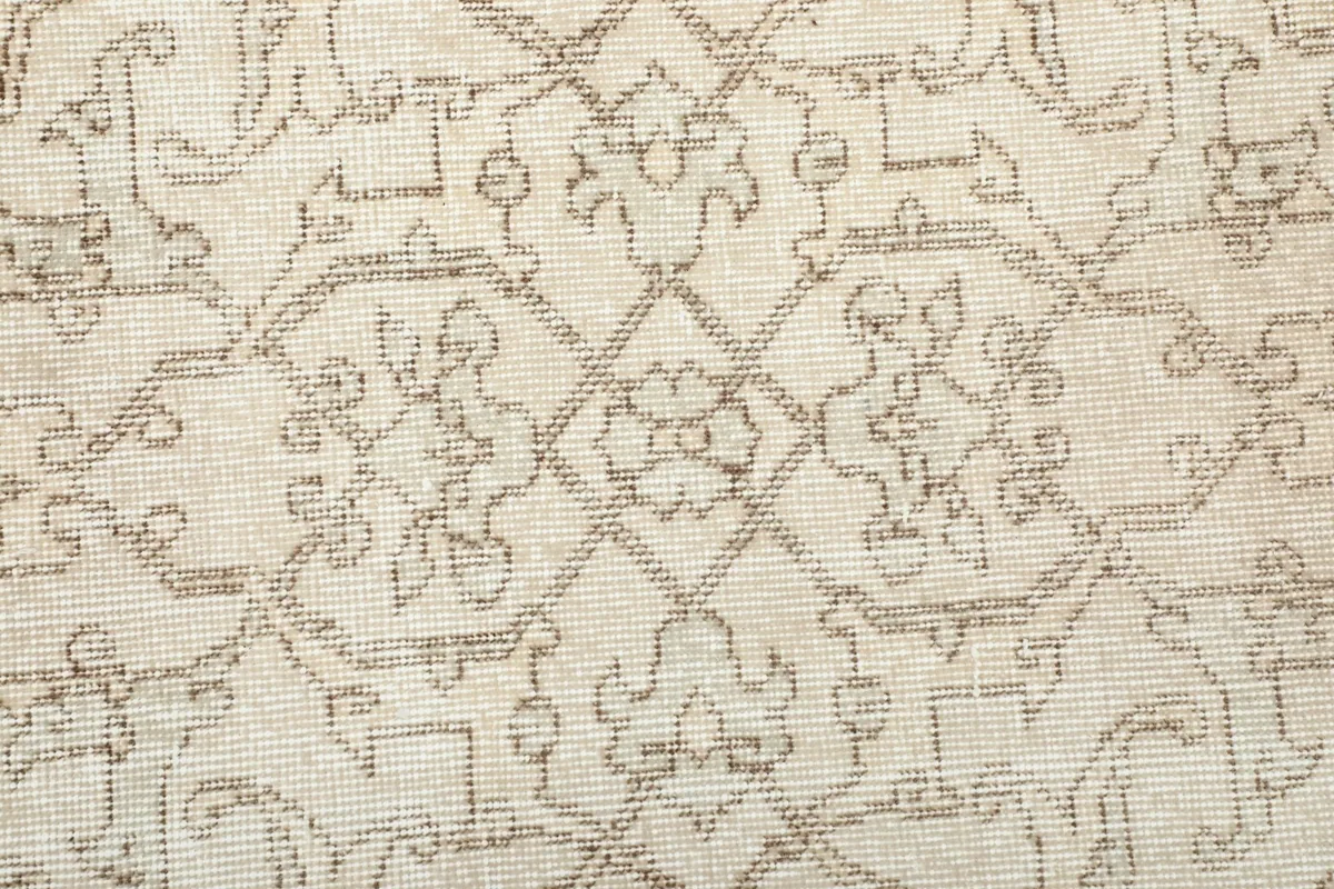 Close-up of the hand-knotted wool pile and intricate geometric motifs.