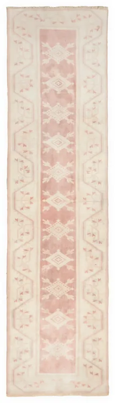 Full overhead view of the 2'4" x 9'3" vintage Anatolian runner rug on a white background