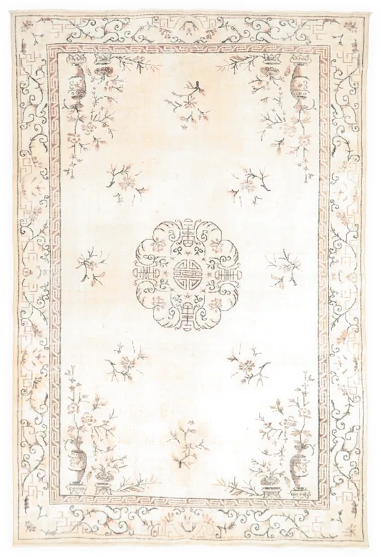 Full overhead view of the ivory vintage Anatolian rug with floral and medallion motifs.