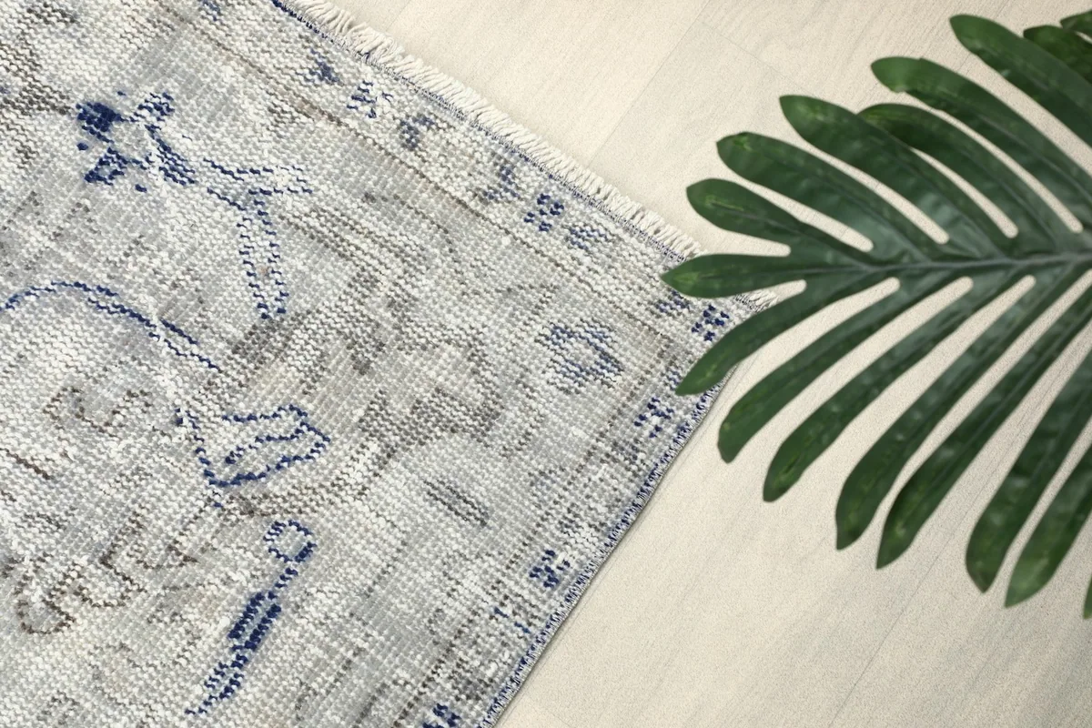 Overhead angle shot highlighting the rug's faded design and texture