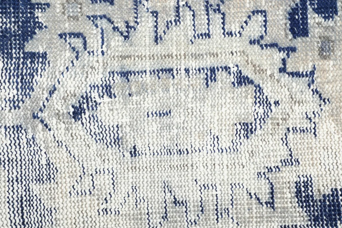 Close-up of the low wool pile and intricate hand-knotted texture