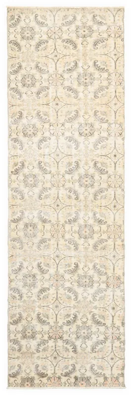 Full top view of the 2'11" x 9'9" cream floral geometric runner rug on a white background