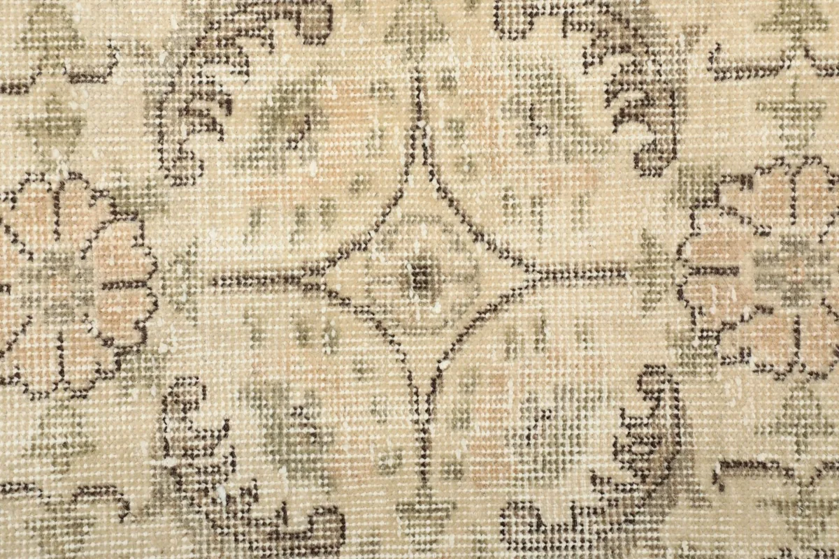 Close-up of the low wool pile and the intricate knotting of the vintage runner