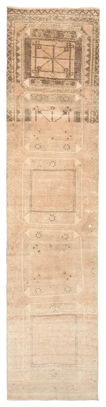 Full overhead view of the beige and brown vintage Anatolian runner rug