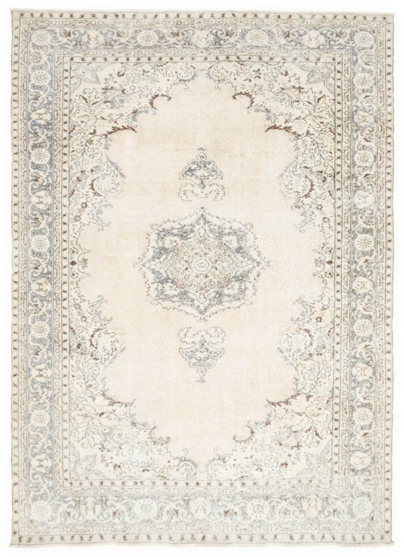 Full top view of the ivory and blue medallion floral vintage rug