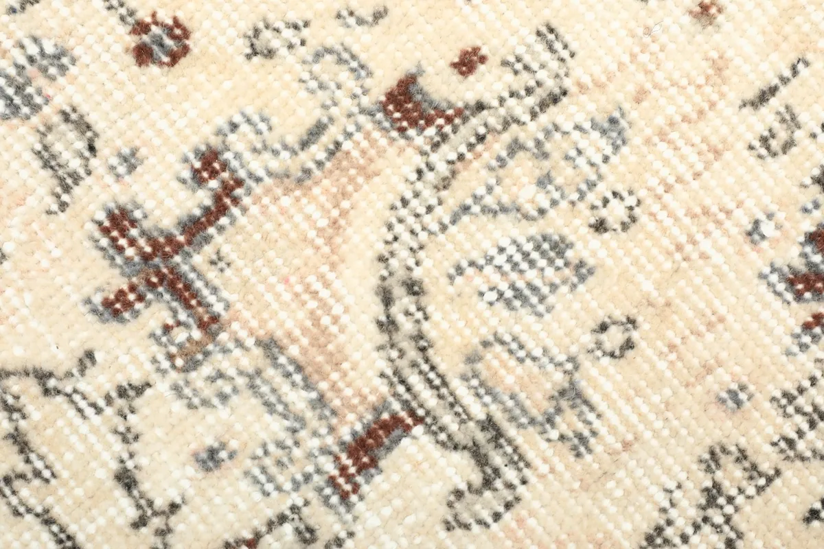 Detailed view of the low wool pile and hand-knotted texture