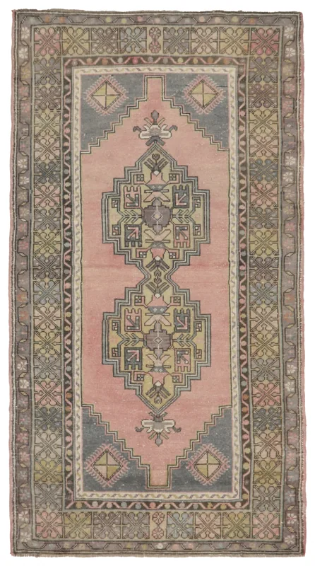Full overhead view of the vintage Anatolian rose geometric area rug on a white background.