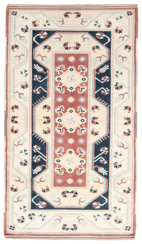 Full top view of the vintage Anatolian rug with ivory, rust, and navy geometric patterns