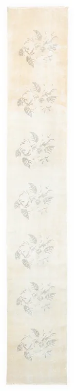 Full top view of the 1'10" x 11'9" ivory runner rug with gray floral patterns.
