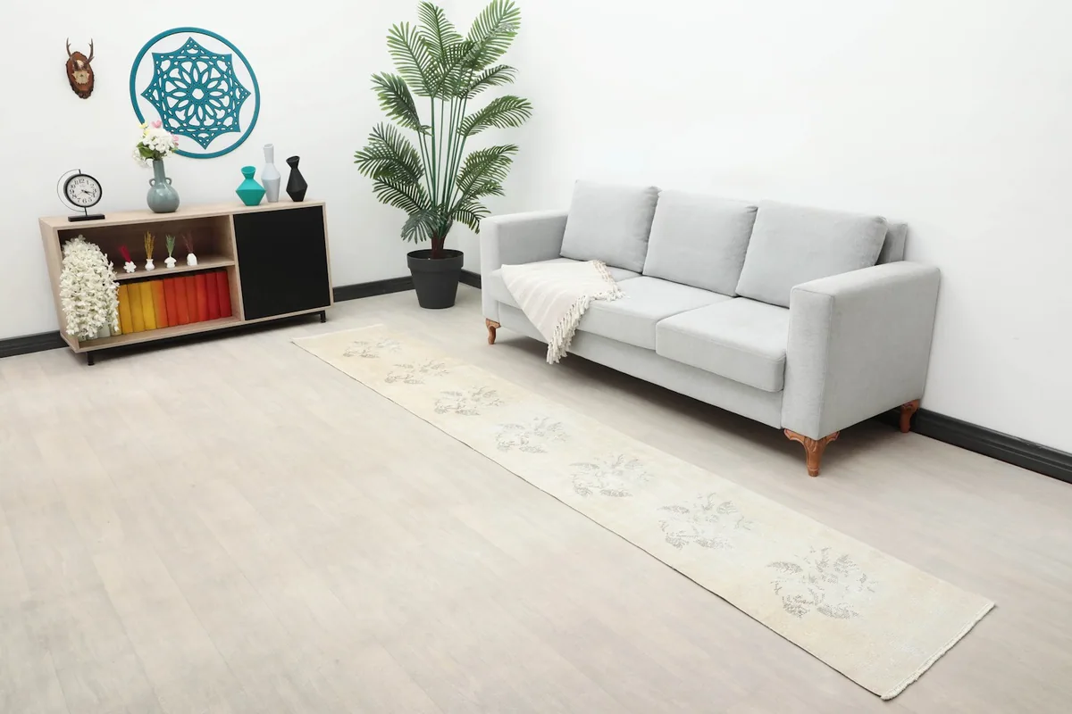 Wide view of the ivory runner in a living space, showing its scale relative to furniture.