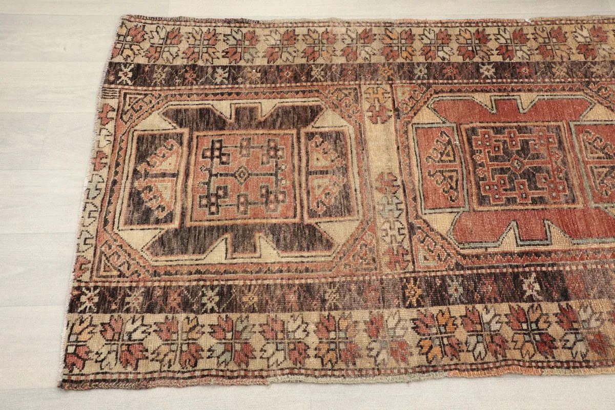 Detailed view of the repeating tribal motifs and color variations in the runner