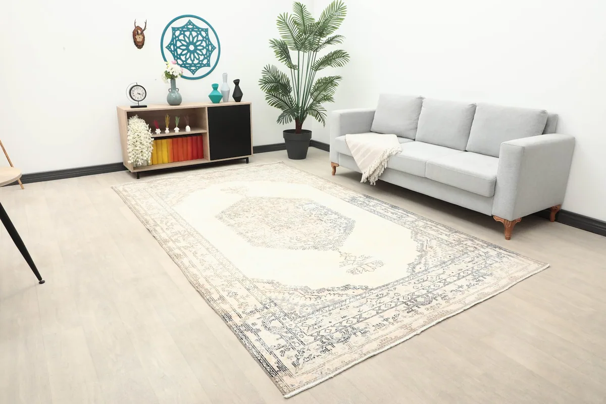 Overall view of the ivory rug in a spacious room, highlighting its placement and scale.