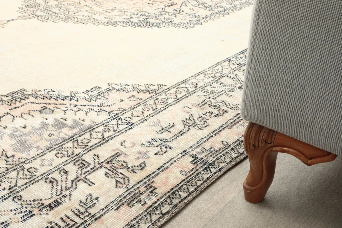 Rug placed under furniture, showing how the patterns and colors complement a modern setting.