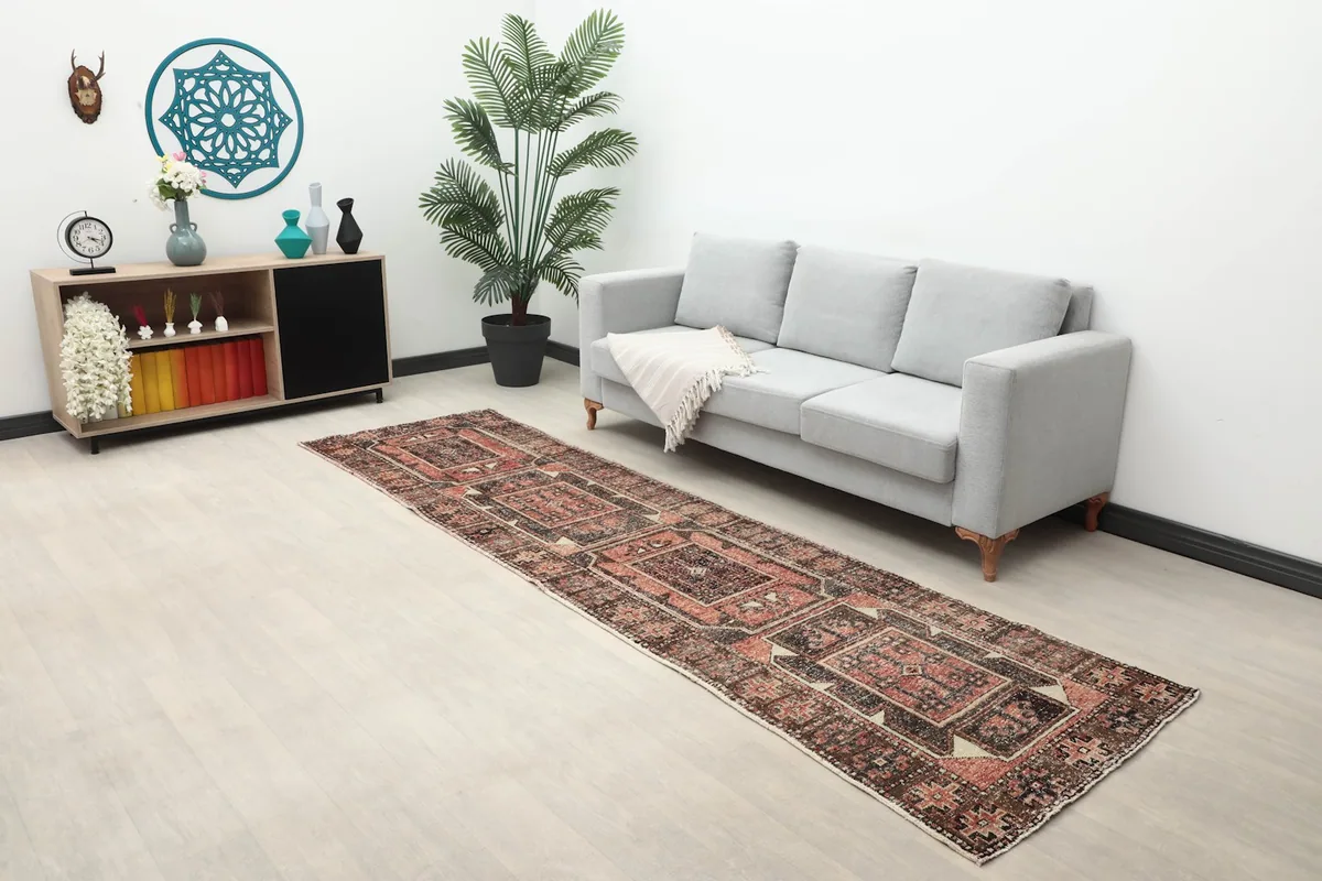 Runner rug displayed in a living room setting with a sofa and decor