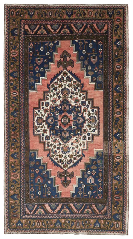 Full top view of the vintage rose and navy medallion area rug on a white background