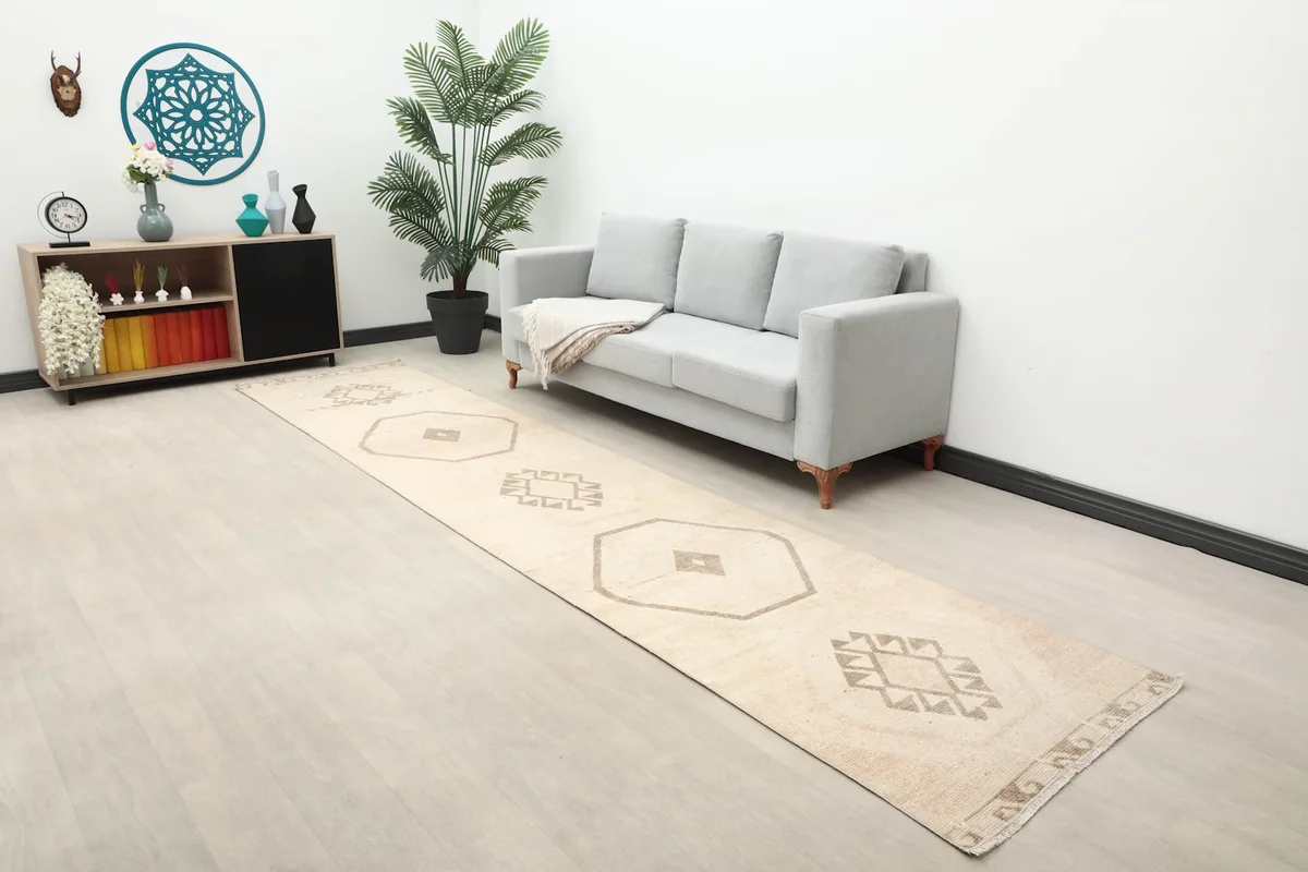 Long view of the Anatolian runner rug in a room with a sofa and decor.