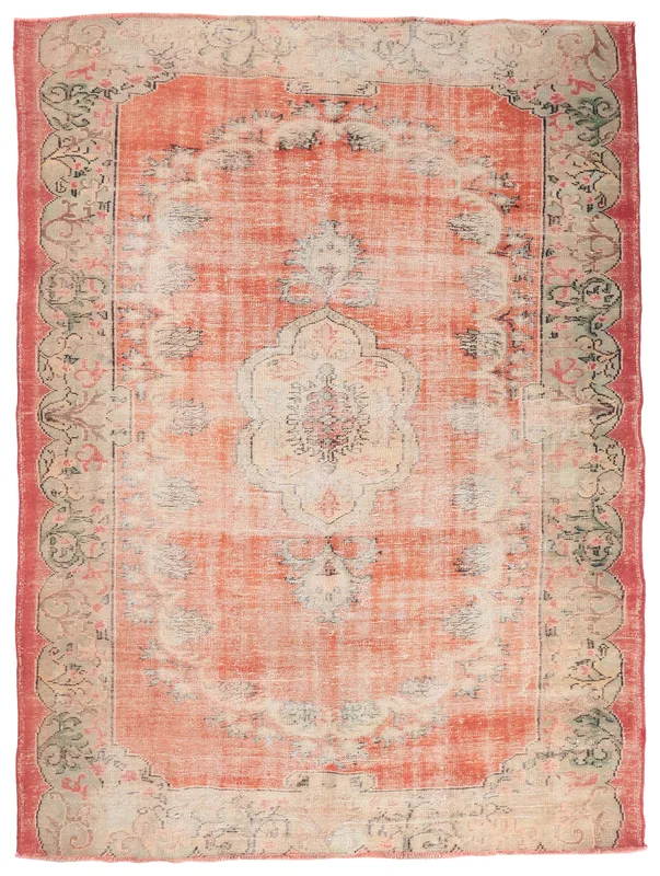 Full top view of the vintage Anatolian rust area rug with a central medallion and floral border.