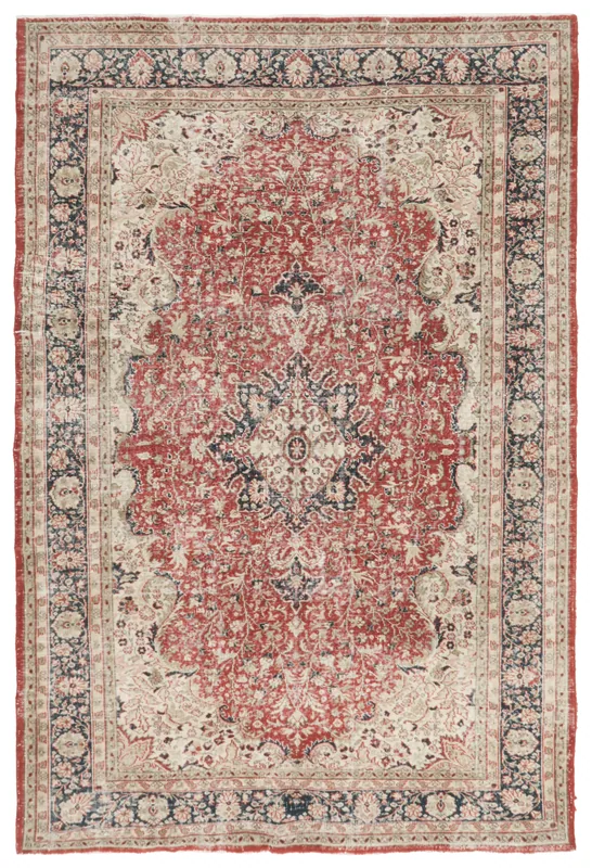 Full top view of the vintage red medallion floral Anatolian rug on a white background