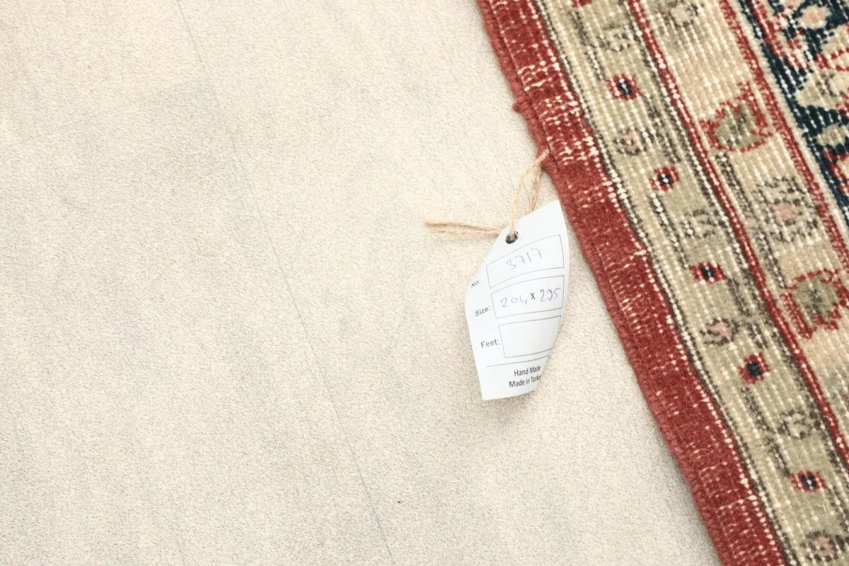 Rug tag attached to the edge of the vintage Anatolian rug