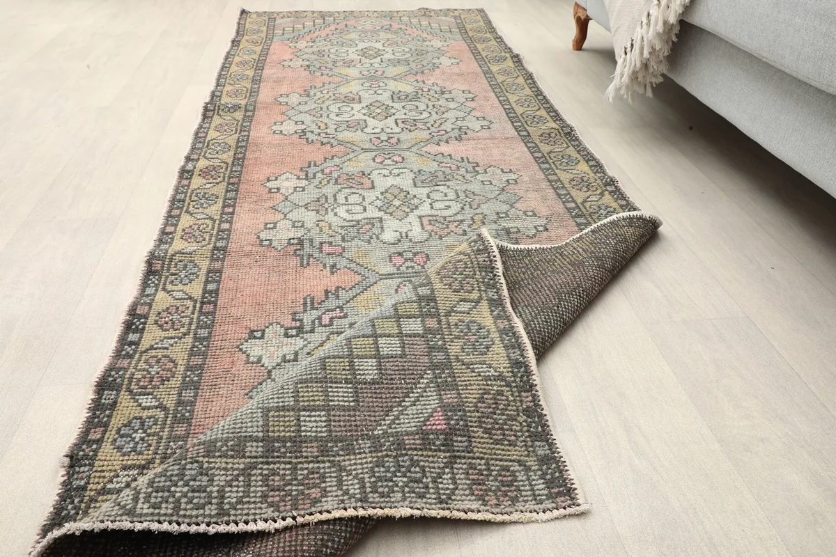 The runner partially unrolled in a room, showing its flexibility and the overall design.