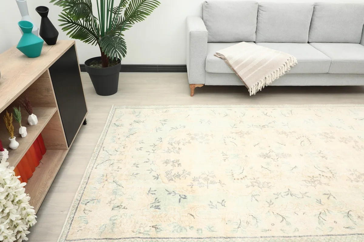 Angle view of the ivory rug in a spacious room, highlighting its placement and size