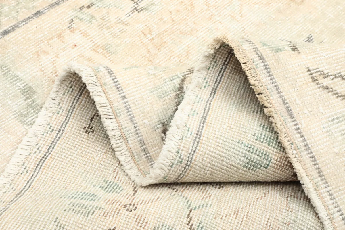 Multiple folds of the rug, illustrating its flexibility and the wool's texture