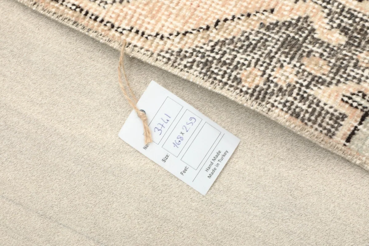 Product tag attached to the rug, displaying size and origin information