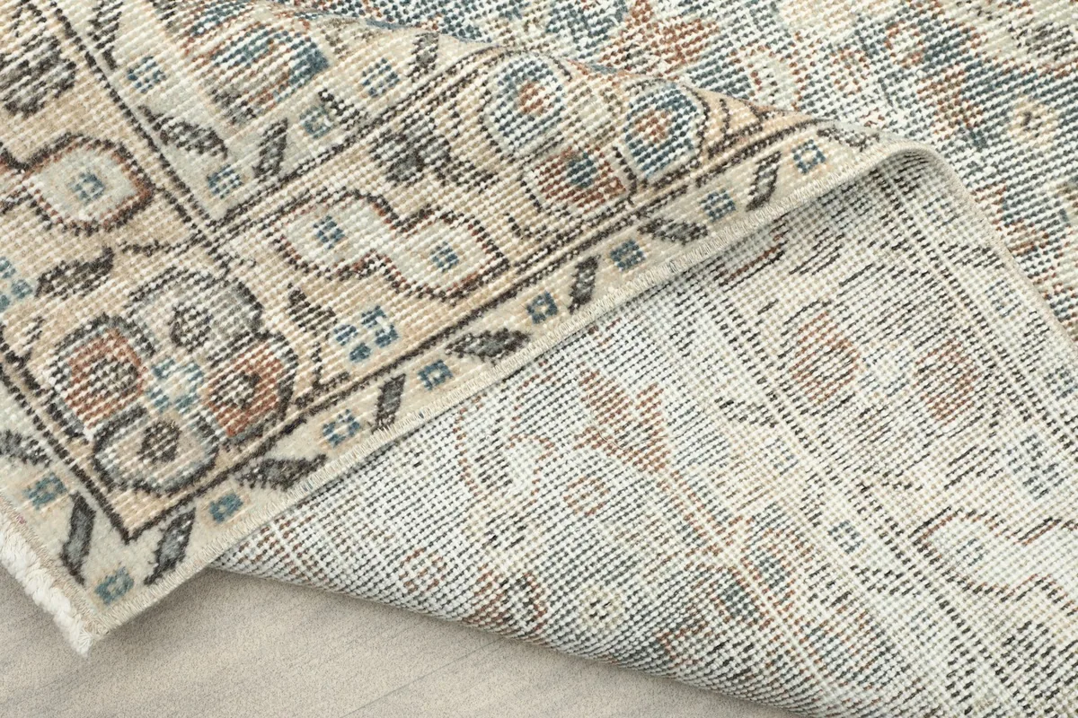 Another view of the rug's underside, revealing the hand-knotted construction