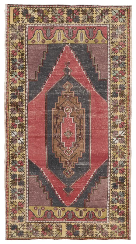 Full top view of a vintage hand-knotted Anatolian area rug with a red and charcoal geometric medallion.