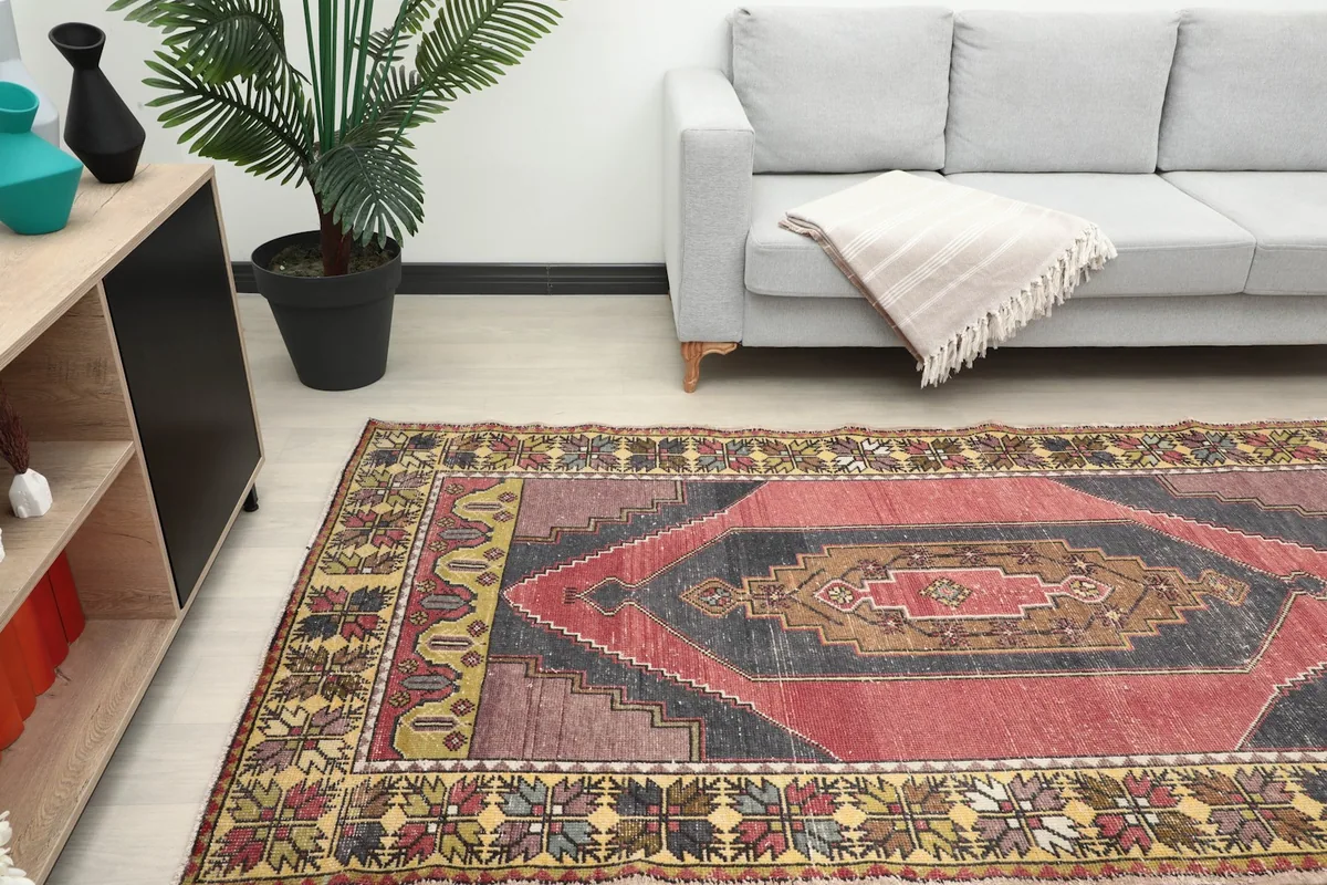 Rug placed in a room, showing its scale and how it complements the surrounding decor.