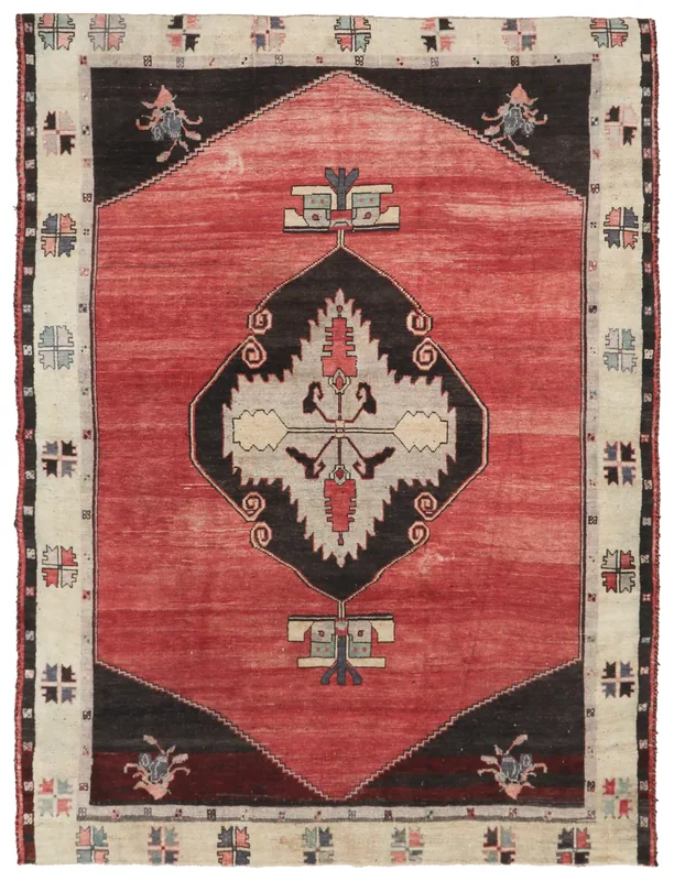 Full overhead view of the vintage red Anatolian rug with a central medallion