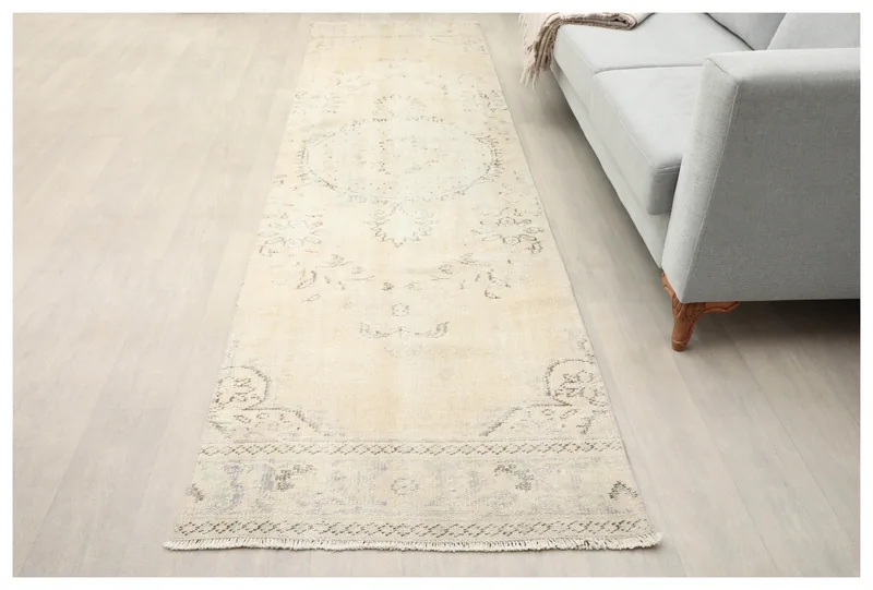 Full top view of the 2'11" x 10'7" vintage Anatolian runner rug on a white background.