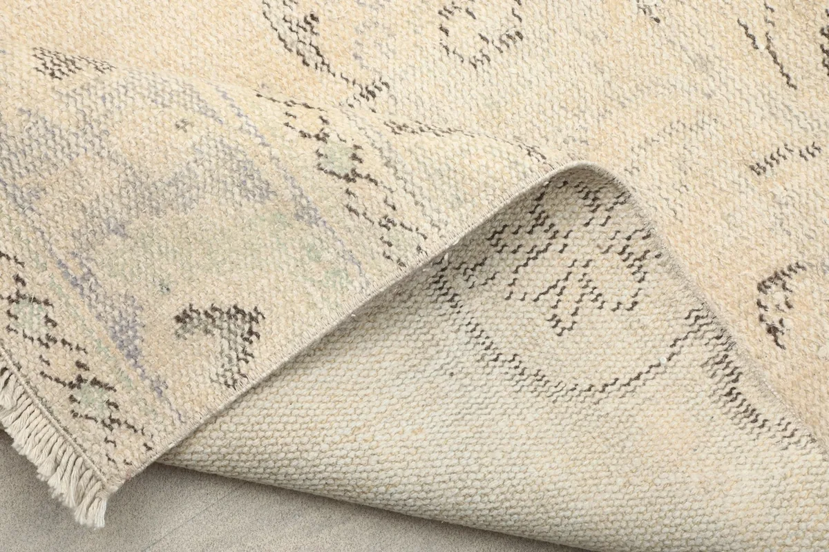 Another folded view revealing the sturdy cotton foundation and the reverse side of the pattern.