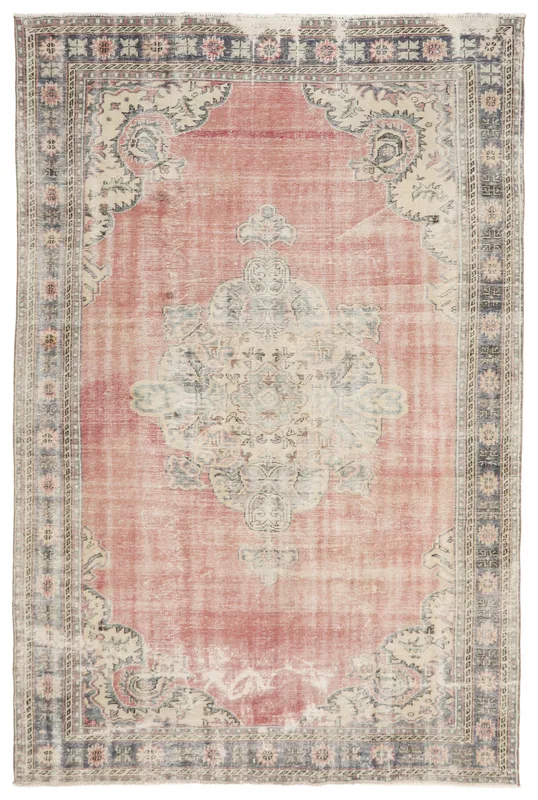 Full top view of the vintage rose and navy Anatolian area rug with central medallion