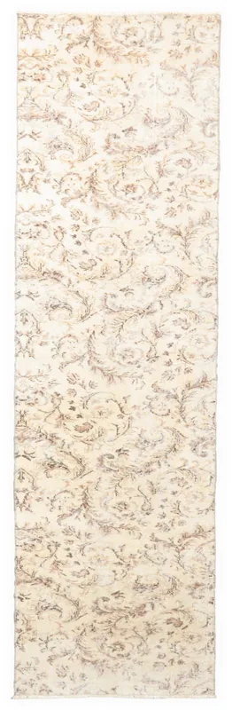 Full top view of the 3'0" x 10'2" ivory and tan floral vintage Anatolian runner rug on a white background.