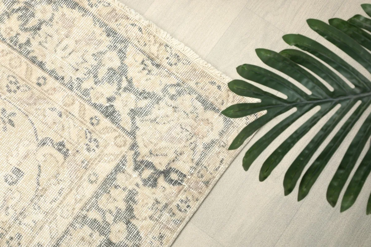 Overhead corner shot of the rug, emphasizing the decorative border and main field design