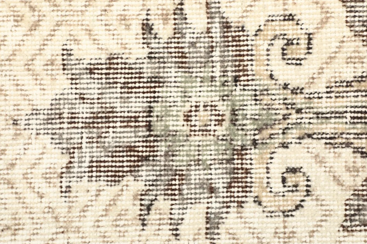 Close-up showing the low wool pile and the intricate texture of the rug's surface