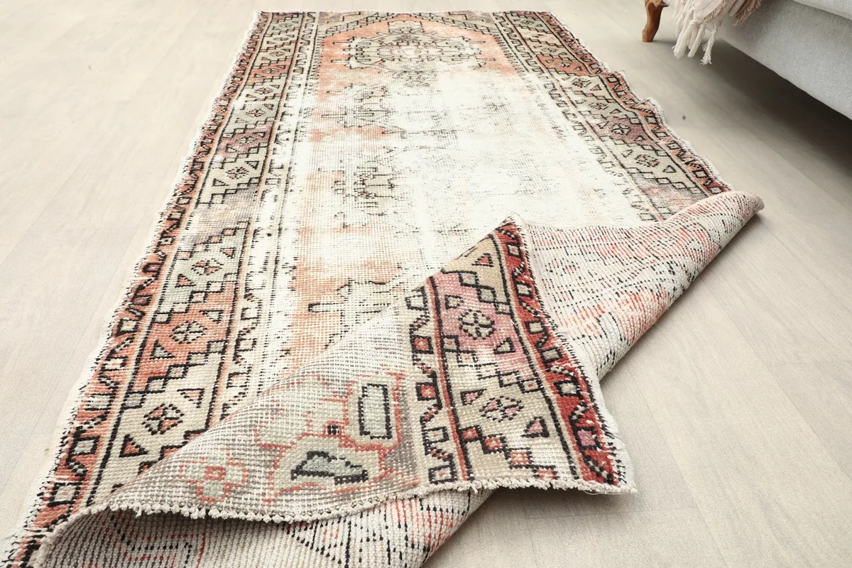 The runner partially folded, showcasing its flexibility and the reverse side