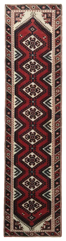 Full top view of the 2'5" x 9'10" vintage red and ivory geometric runner rug